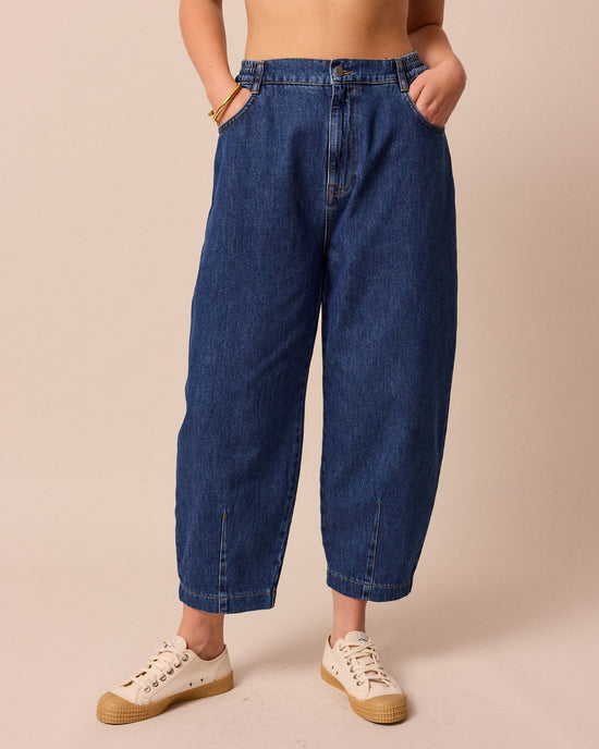 model wears remi mid wash denim jeans right