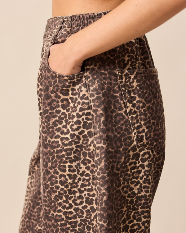 model wears remi leopard print denim jeans 