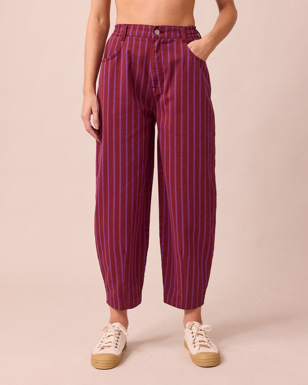 model wears remi russet and violet denim jeans front