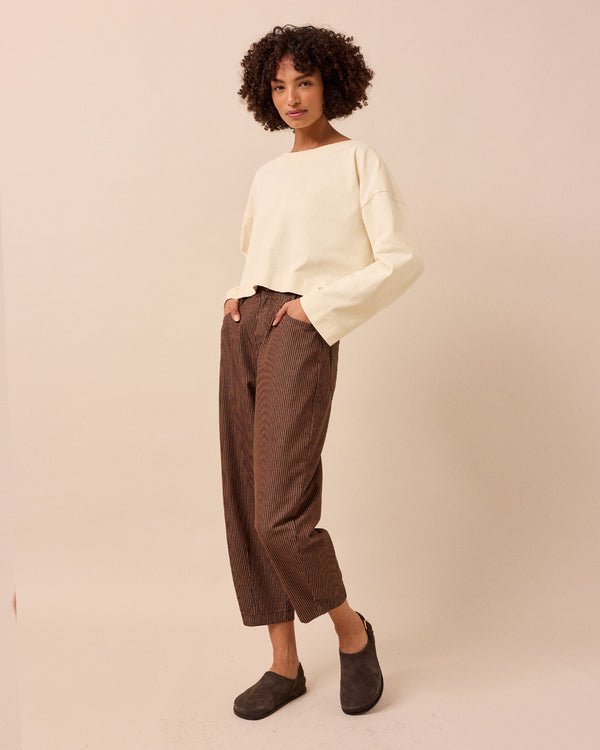 model wears remi hickory rust stripe jeans back