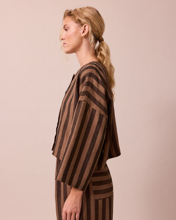 model wears romy walnut stripe linen top