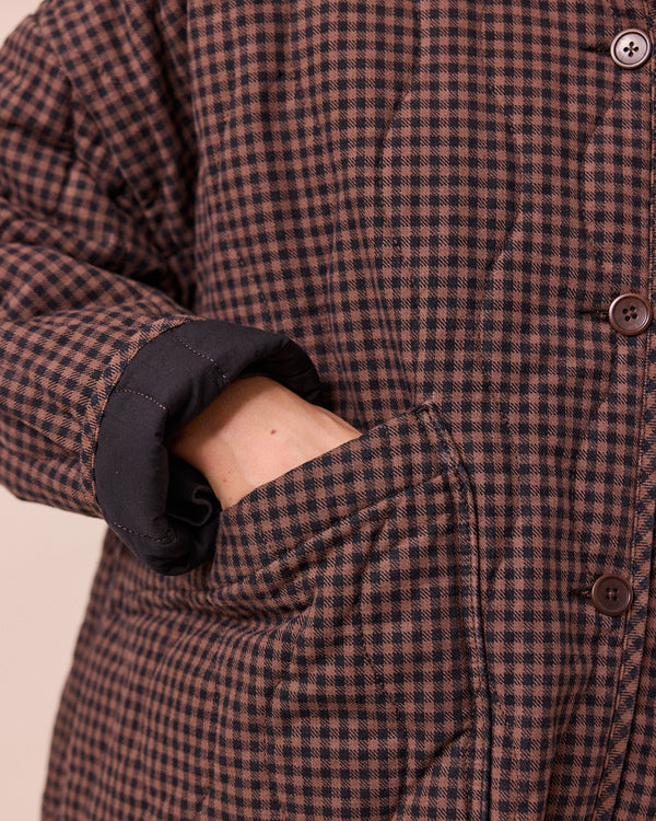 model wears rue cocoa gingham denim jacket