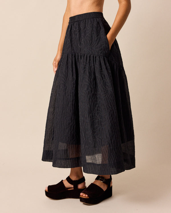 model wears talia black organza skirt