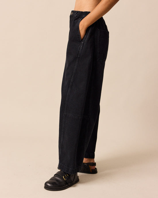 model wears tori washed black denim jeans left