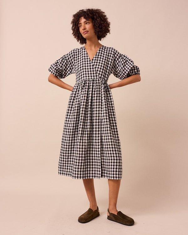 model wears winnie black and white gingham linen dress