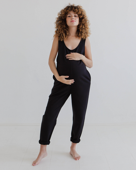 model wears black jersey laura jumpsuit