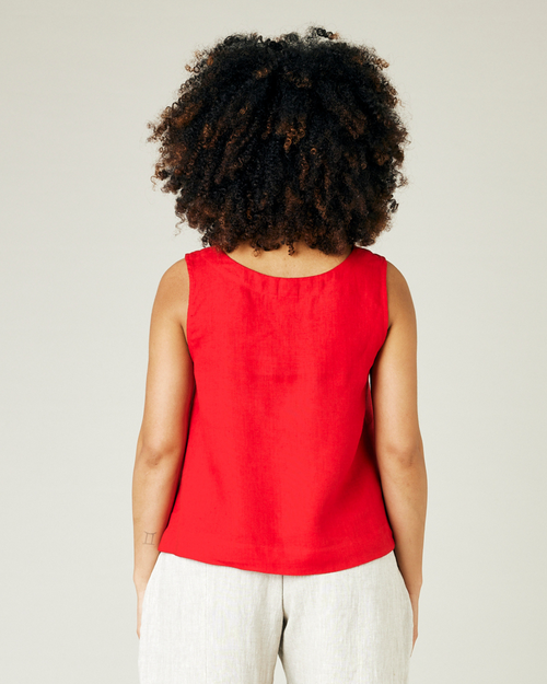 pregnant model wears red linen tara top