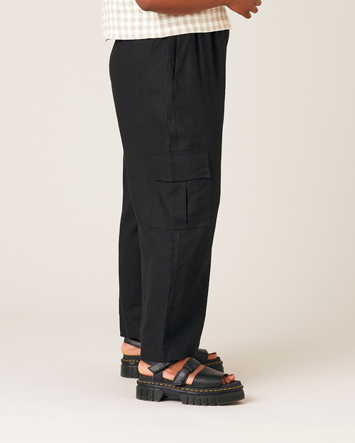 model wears black orla linen trousers right