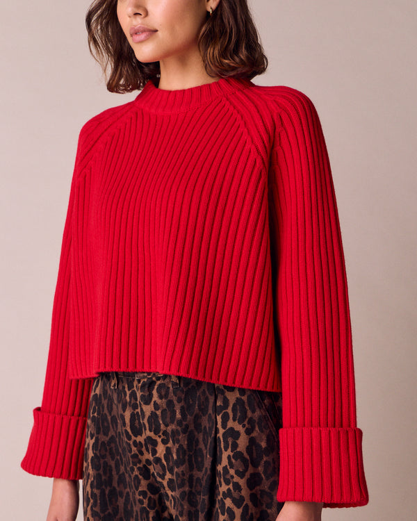 model wears cadi cherry red knitted jumper