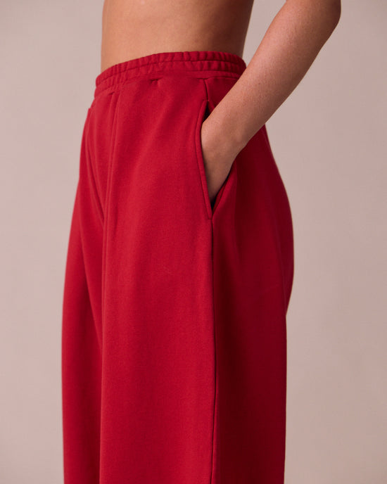 model wears daisy cherry red fleeceback jersey trousers 
