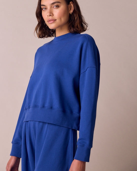model wears eden cobalt jersey fleeceback jumper