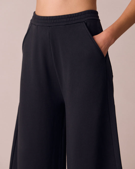 model wears helina washed black jersey trousers