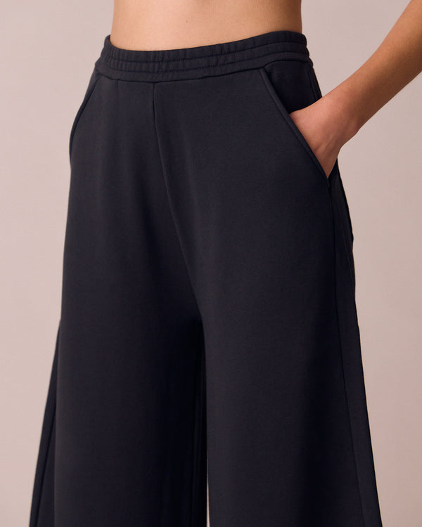 model wears helina washed black jersey trousers