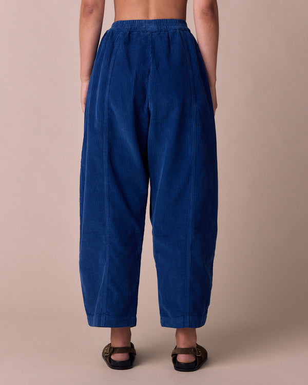 model wears mabel lapis blue cord trousers back