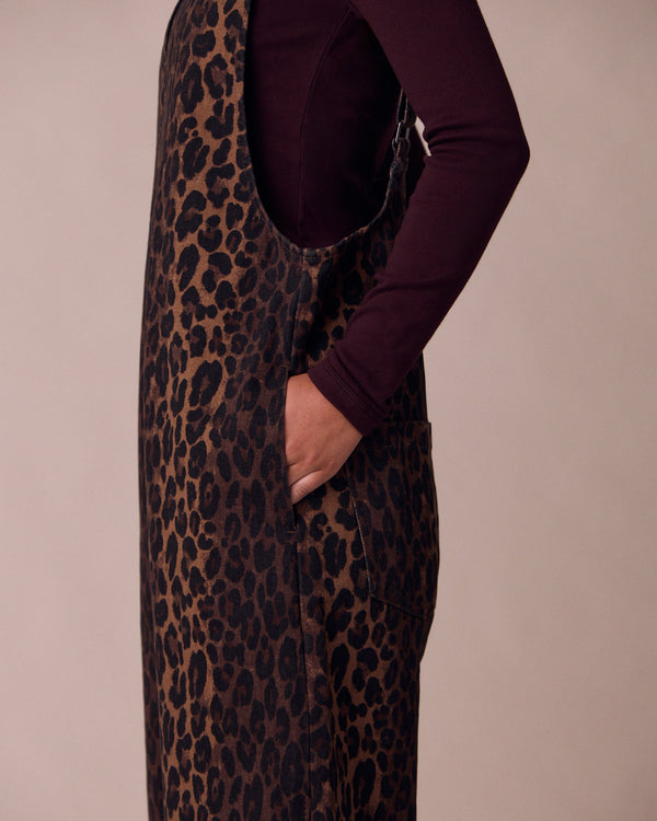 model wears ottie dark leopard denim jumpsuit