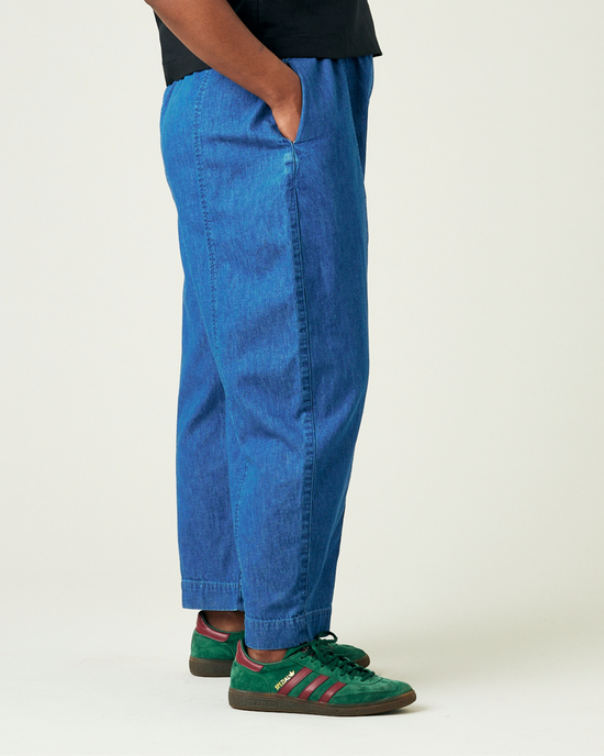 model wears mid wash chambray mabel trousers right