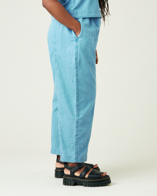 model wears light wash chambray mabel trousers right