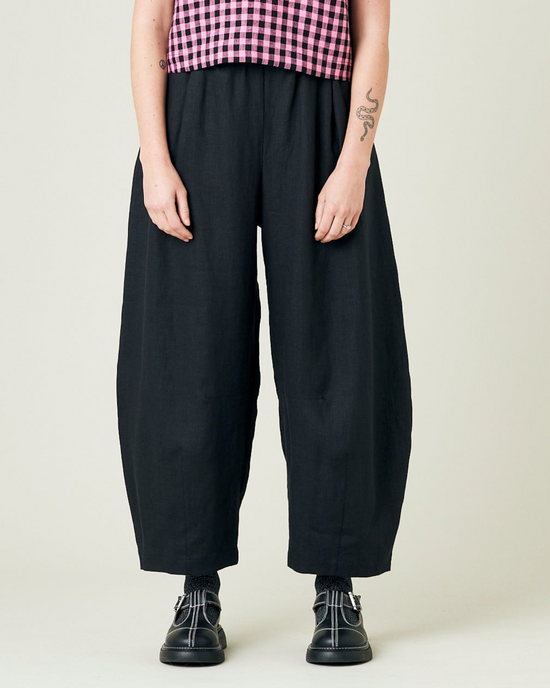 model wears black daisy linen trousers 