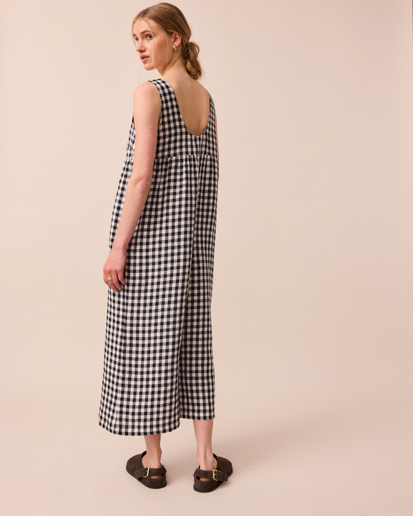 model wears black and white gingham savannah linen jumpsuit