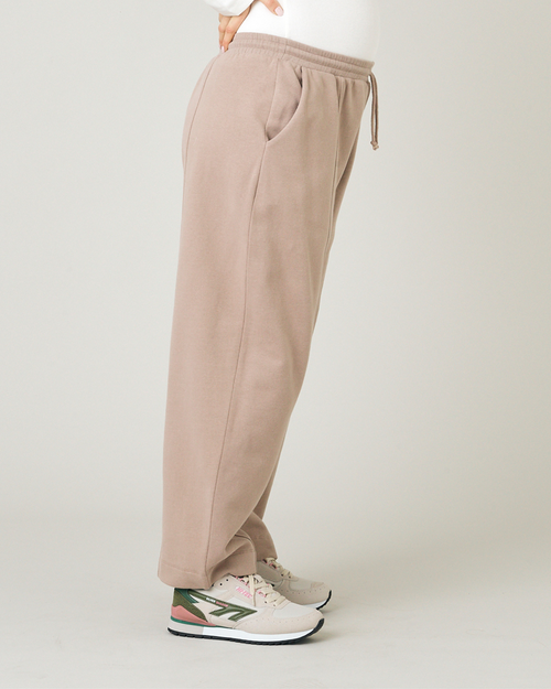 model wears jenny jersey latte trousers right