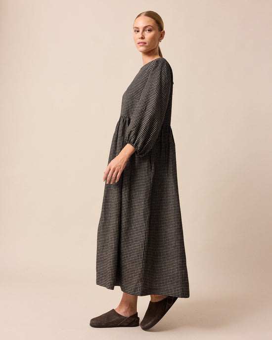 model wears berlin black mini grid linen dress