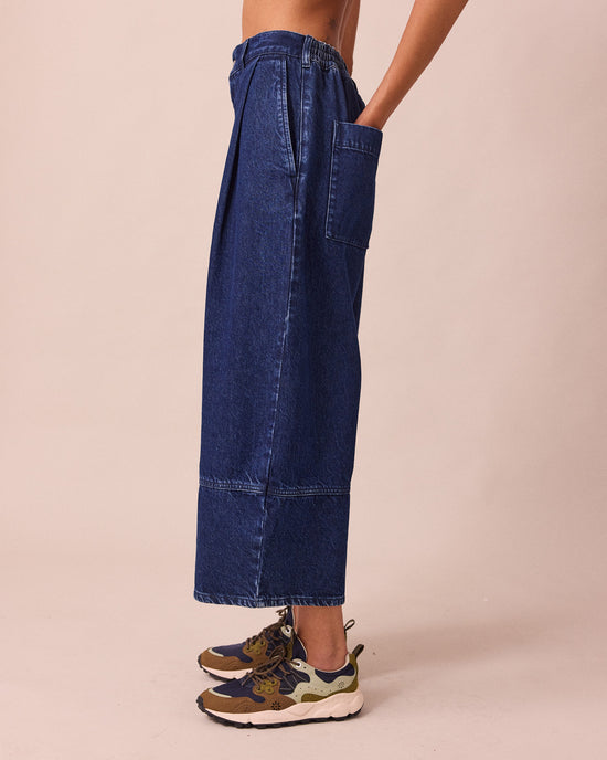 model wears blair dark wash denim jeans left