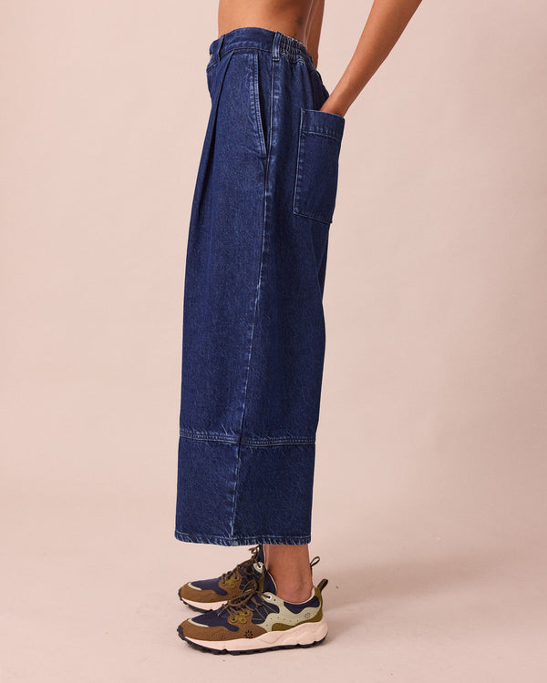 model wears blair dark wash denim jeans left