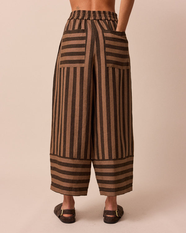 model wears walnut stripe bobbi linen trousers back