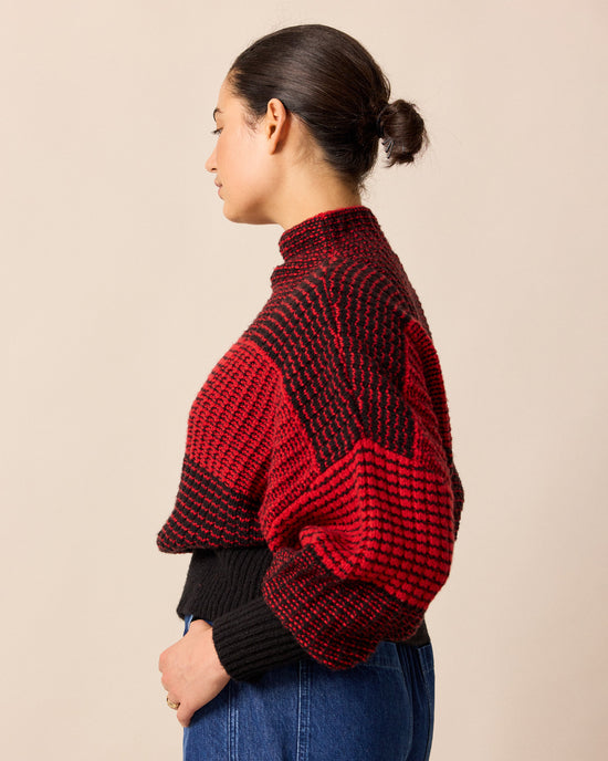 model wears chelsea red and black check knitted jumper