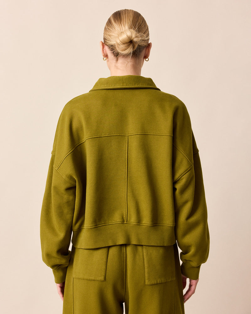 model wears cleo fresh olive jersey jumper