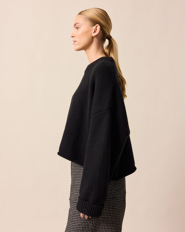 model wears coco black knitted jumper