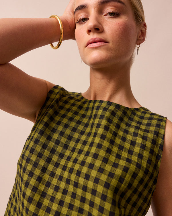 model wears green gingham linen esme top