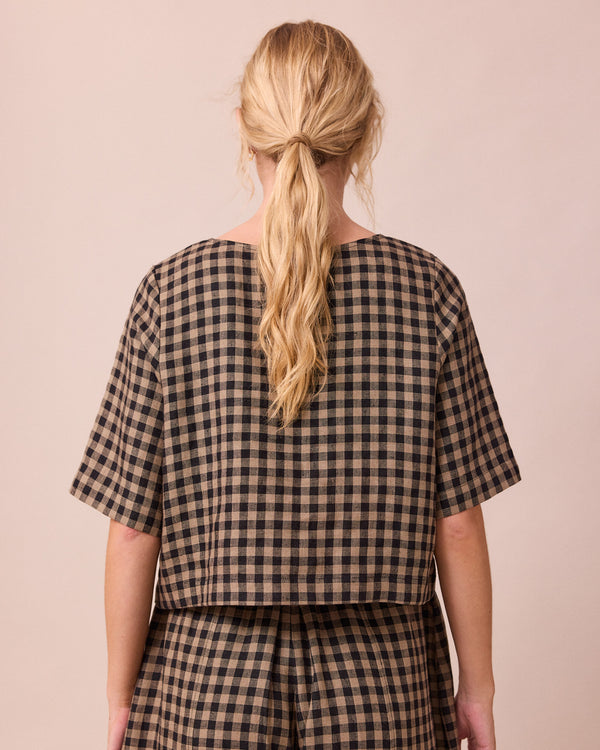model wears evelyn coffee gingham linen top back