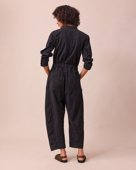 model wears jill black textured cotton jumpsuit