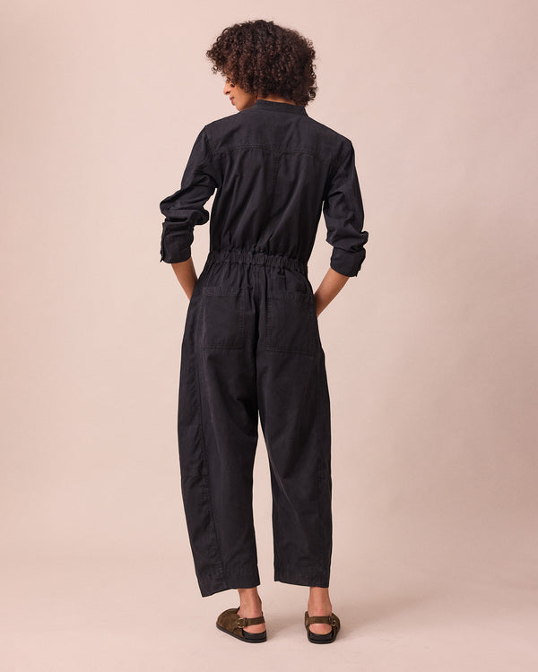 model wears jill black textured cotton jumpsuit