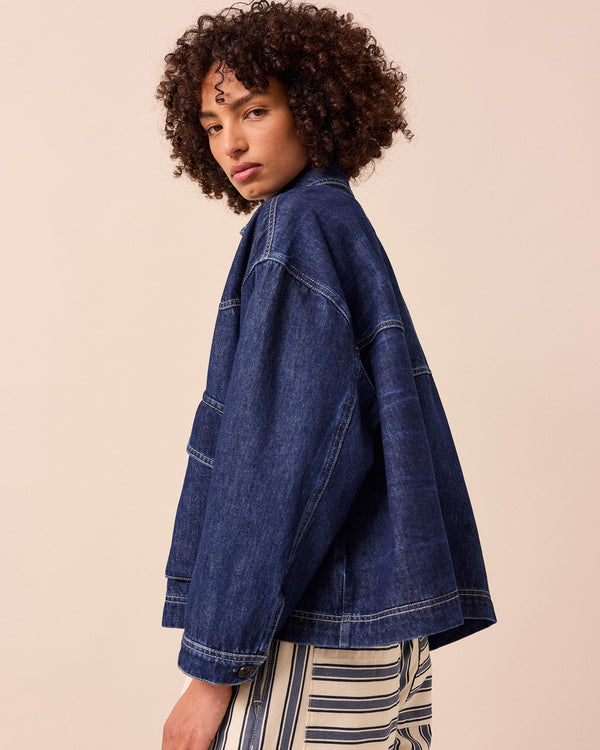 model wears dark wash denim kitty jacket