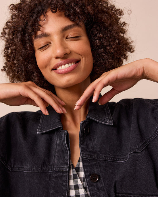 model wears kitty washed black denim jacket