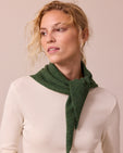 model wears knitted apple green neckerchief
