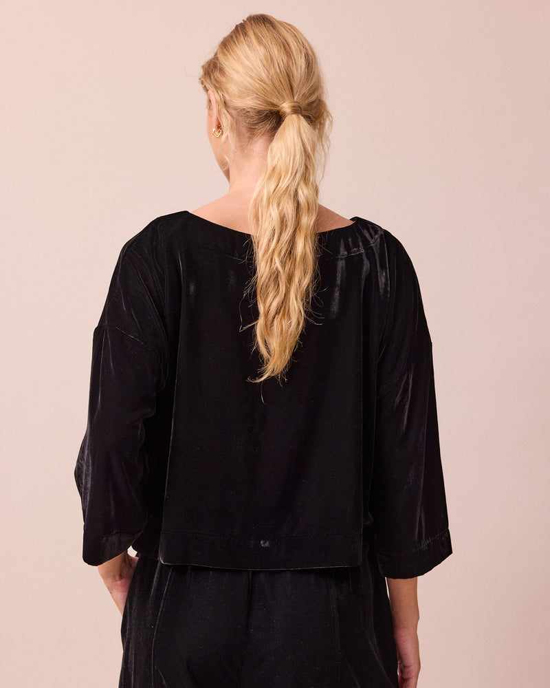 model wears lily black velvet top