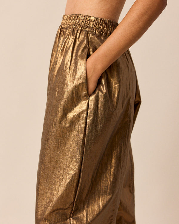 model wears mabel bronze linen trousers