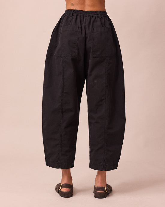 model wears millie black heavy cotton trousers back