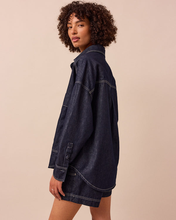 model wears olla indigo wash denim shirt