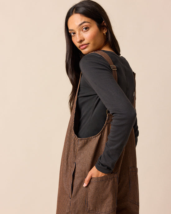 model wear ottie rust hickory stripe denim jumpsuit