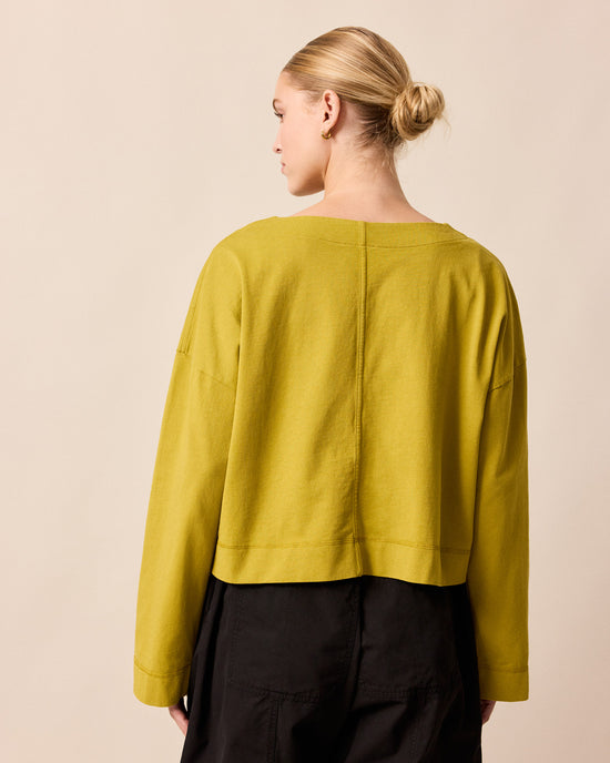 model wears peggy golden pear jersey top