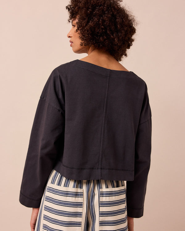 model wears peggy washed black jersey top