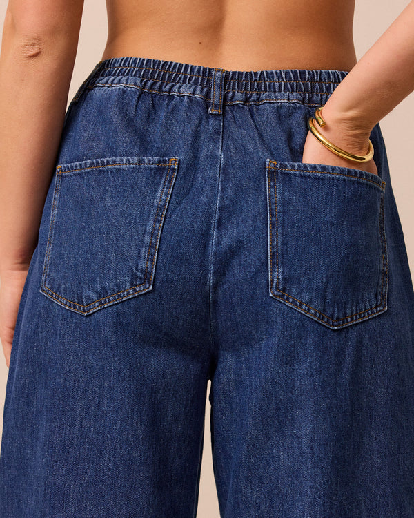 model wears remi mid wash denim jeans