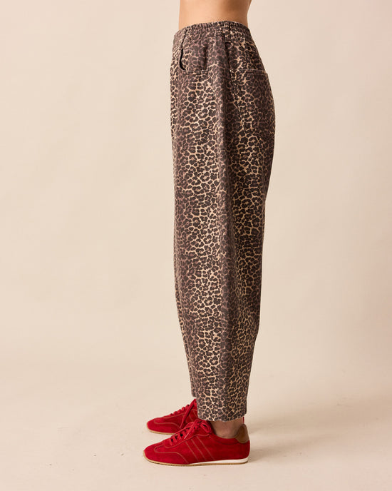 model wears remi leopard print denim jeans left