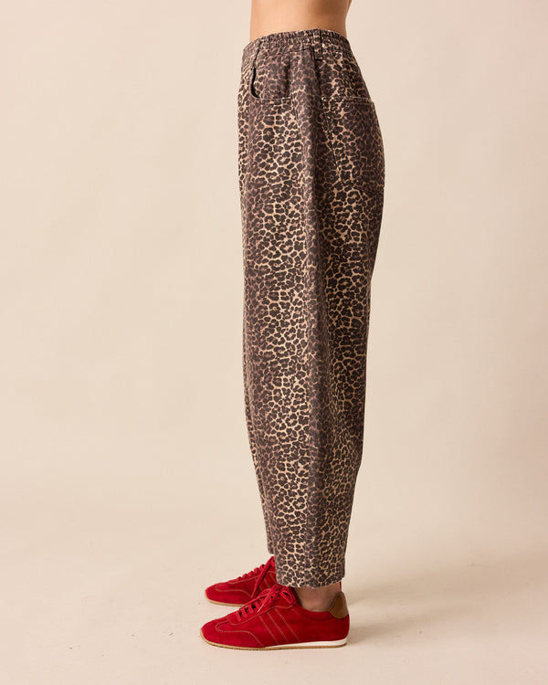 model wears remi leopard print denim jeans left