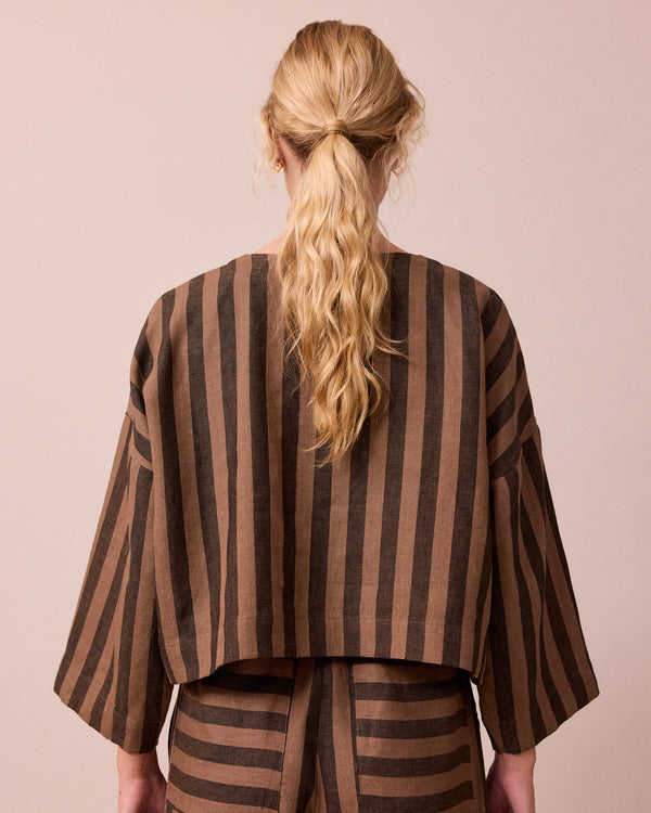 model wears romy walnut stripe linen top