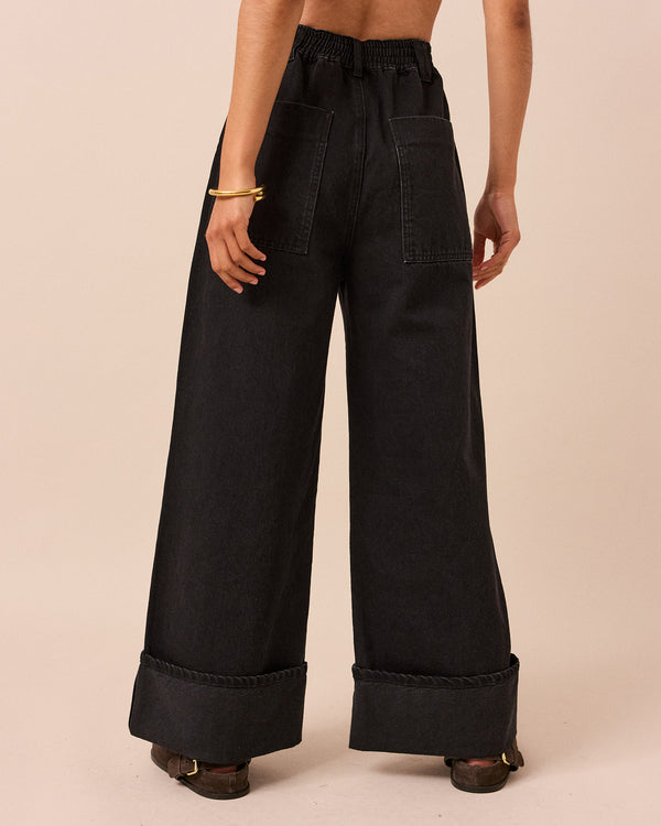 model wears teddi washed black denim jeans back